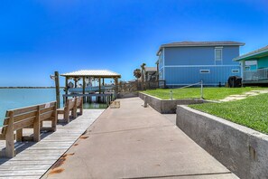 Enjoy waterfront views from the balcony and grill area, with a gazebo at the dock.