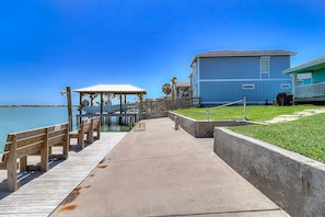 Enjoy waterfront views from the balcony and grill area, with a gazebo at the dock.