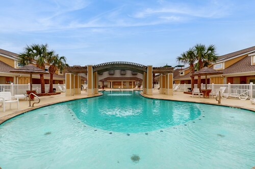 Poolside Beauty w/ Private Balcony, Patio & Heated Pool – Steps to Beach