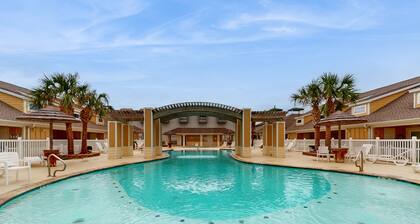 Poolside Beauty w/ Private Balcony, Patio & Heated Pool – Steps to Beach