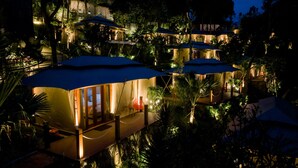 A multi-level resort with several overwater bungalows, connected by bridges, surrounded by lush vegetation. - JSI Resort (Megamendung)