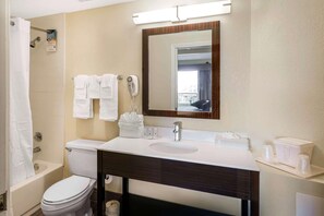 A bathroom with a toilet, sink, and shower. - Boca Suites Deerfield Beach Surestay Collection BW (Deerfield Beach)
