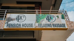 A signboard for '4K's Pension House' with a relaxing massage advertisement. - 4k's Pension House by Cocotel (Bogo)