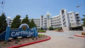 A multi-story hotel with a prominent entrance sign reading "Captiva Bay."