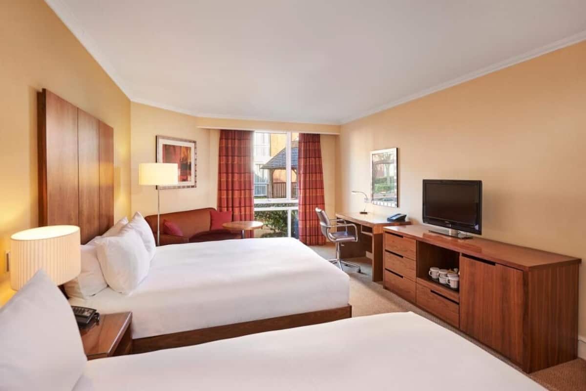 family room | in-room safe, laptop workspace, blackout curtains, iron/ironing board