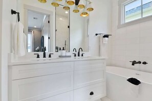 Bathtub, hair dryer, towels, soap