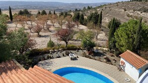 A pool area with a view of a hilly landscape. - Romantic 5 Bedroom Villa with private salted Pool. Cyprus (Fyti)