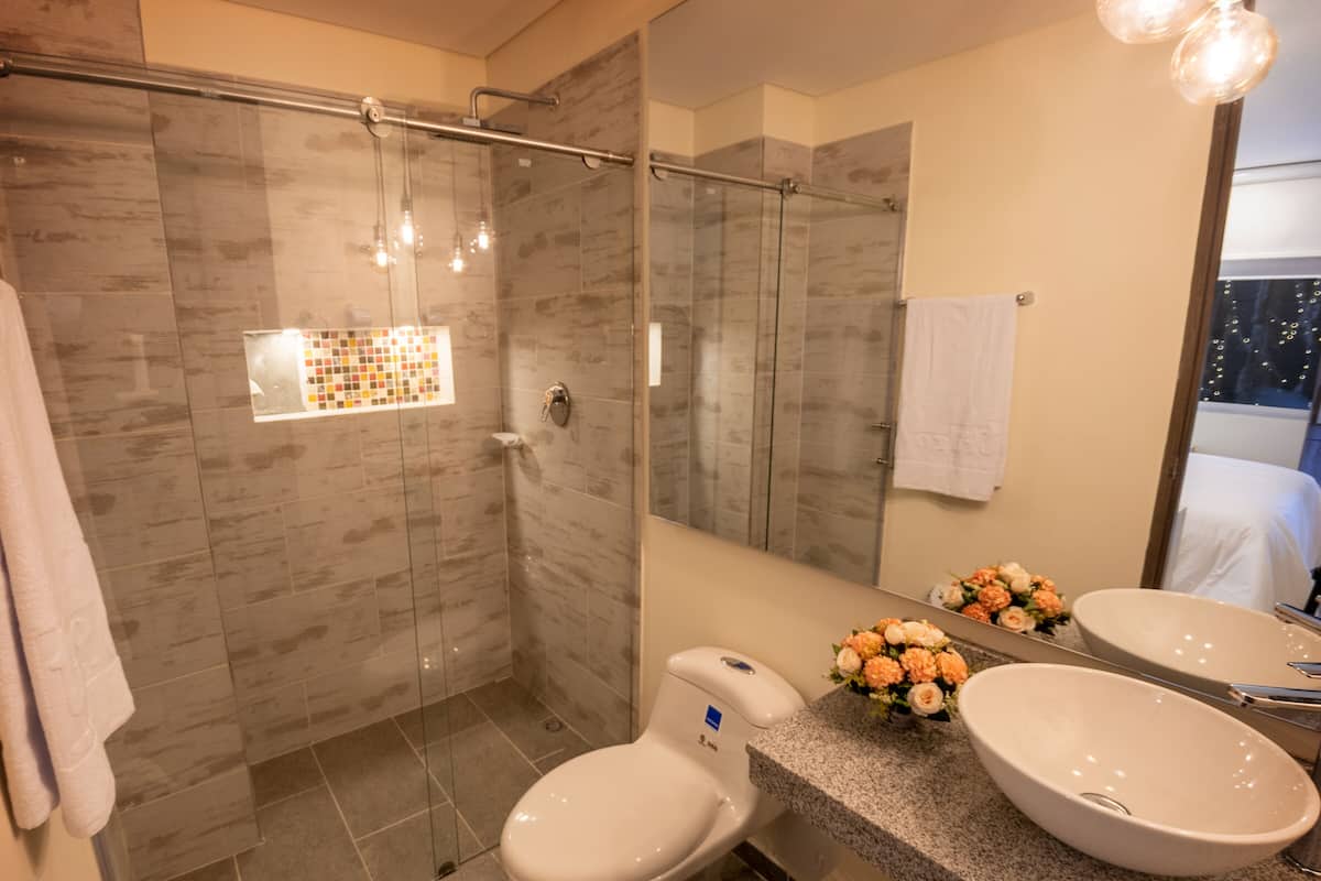 shower, rainfall showerhead, towels, soap