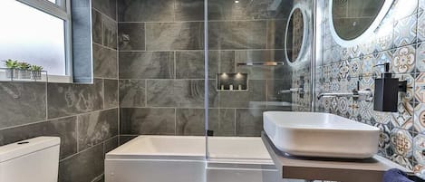 Bathtub, hair dryer, towels