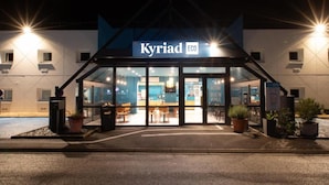 A modern hotel entrance with glass doors and a sign reading "Kyriad ECO". - Kyriad ECO - Nevers Nord Varennes Vauzelles (Varennes-Vauzelles)