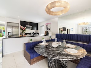A modern kitchen with a built-in microwave, a stove, and a sink.