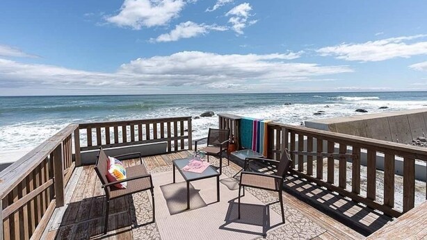 A wooden deck with outdoor furniture overlooking the ocean. - Scituate-Weddings, Family Gatherings, Pet Friendly (Scituate)