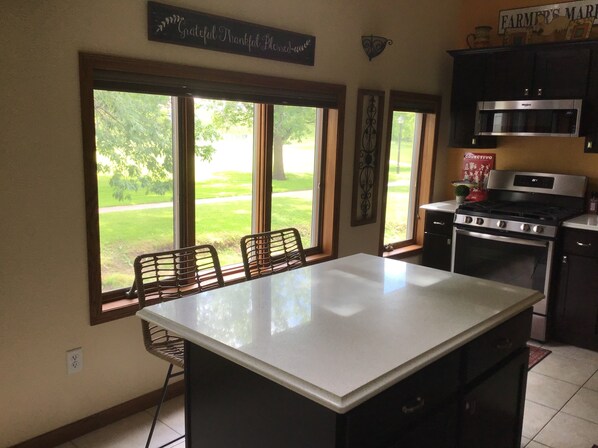 Private kitchen - Lovely riverfront destination featuring open concept loft style. Water view. (Mishicot)