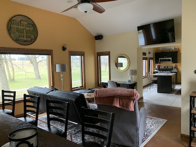 Lovely riverfront destination featuring open concept loft style. Water view.