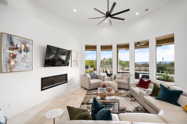 A spacious living room upstairs to watch your favorite shows, or just sit by the fire and enjoy the views.
