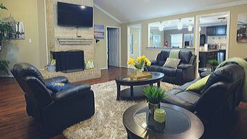 Exclusive House, 4 Bedrooms | Living area | Flat-screen TV