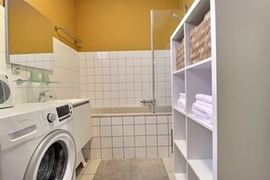 Combined shower/tub, hair dryer, towels, soap