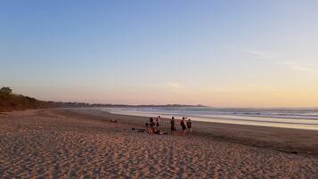 Beach nearby, white sand, beach towels