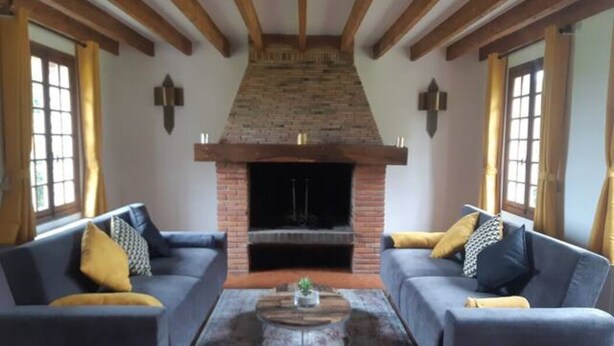 A living room with two sofas, a fireplace, and a coffee table. - 3 Bedroom Private vacation home in ROSAY SUR LIEURE (ROSAY SUR LIEURE)