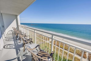 A balcony with a view of the beach and ocean. - New 3BR King Suite with Direct Oceanfront End Unit (Myrtle Beach)