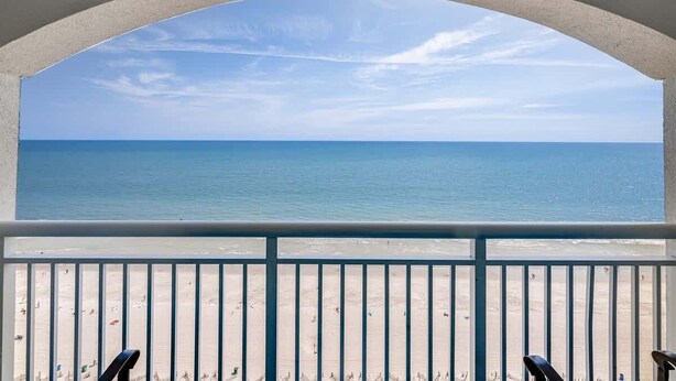 A balcony with a view of the ocean. - New Penthouse-Oceanfront, Heated Pools, TOP Floor (Myrtle Beach)