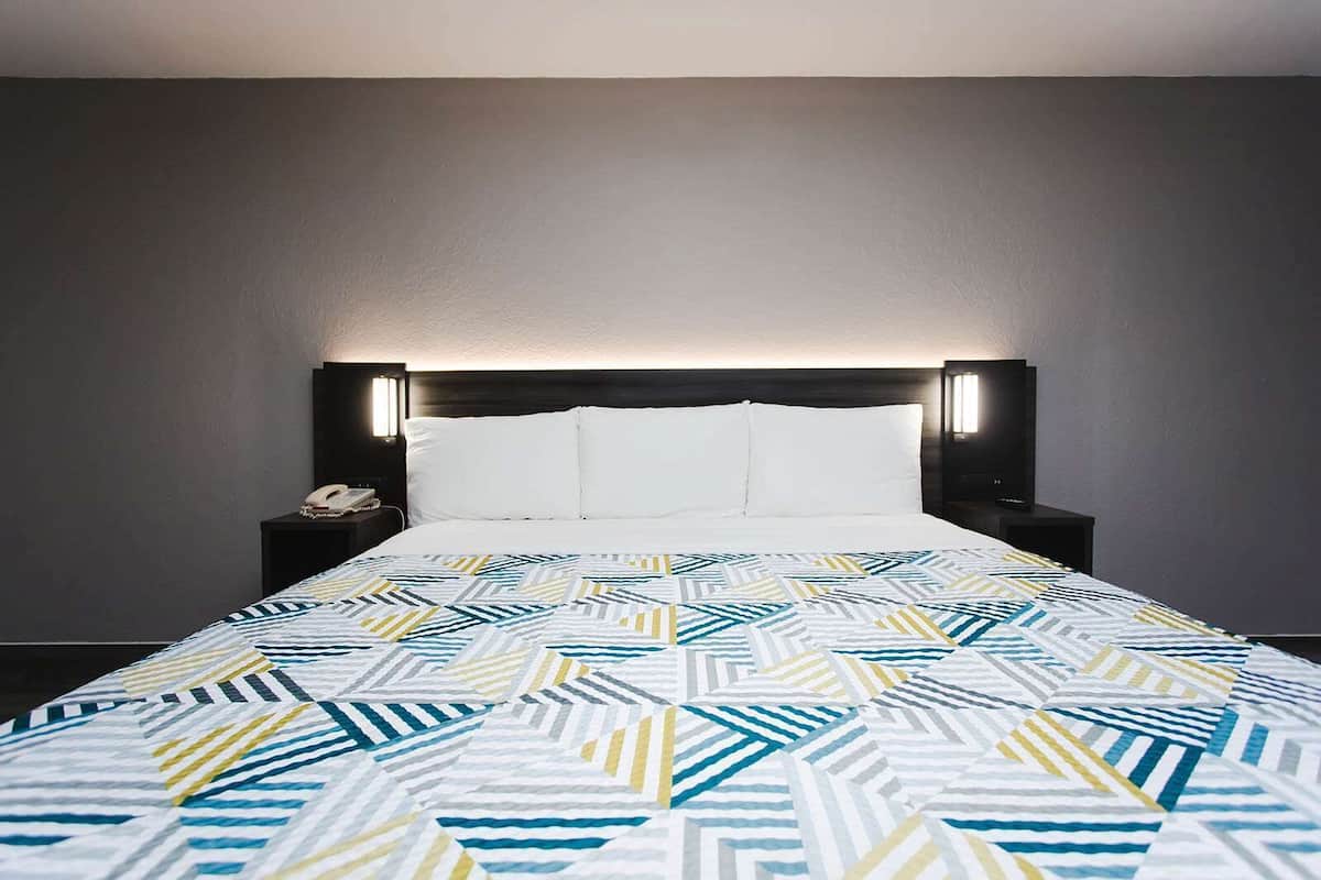 Desk, laptop workspace, blackout drapes, iron/ironing board