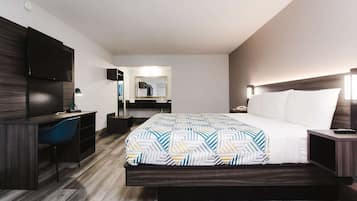 Desk, laptop workspace, blackout drapes, iron/ironing board