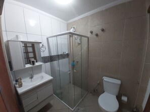 Shower, hair dryer, towels, toilet paper
