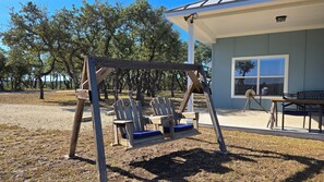 Outdoor dining - Cozy hilltop guesthouse at Barkspin Oaks Ranch. Beautiful views! (Dripping Springs)