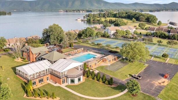 A large building with a swimming pool, tennis courts, and a parking lot. - Amazing View, Quiet Cove of Bernards Landing, Sandy Beach, 3 Kings and Twin Bunk (Moneta)
