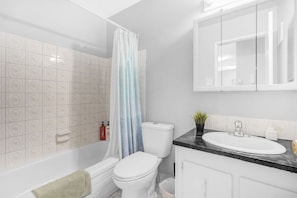 Combined shower/bathtub, hair dryer, towels, soap