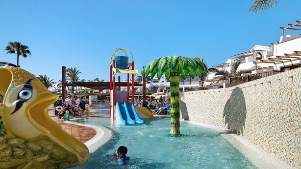 A water park with slides and a pool area.