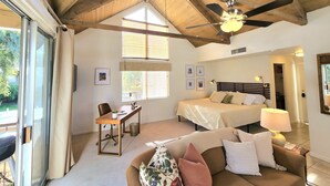A bedroom with a bed, a desk, and a window. - Peaceful Desert Studio Condo near La Quinta & Palm Desert.  Tons to do! (Indian Wells)