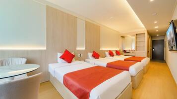 Family Triple Room, 1 Bedroom, Non Smoking, City View | Hypo-allergenic bedding available, down comforters, desk