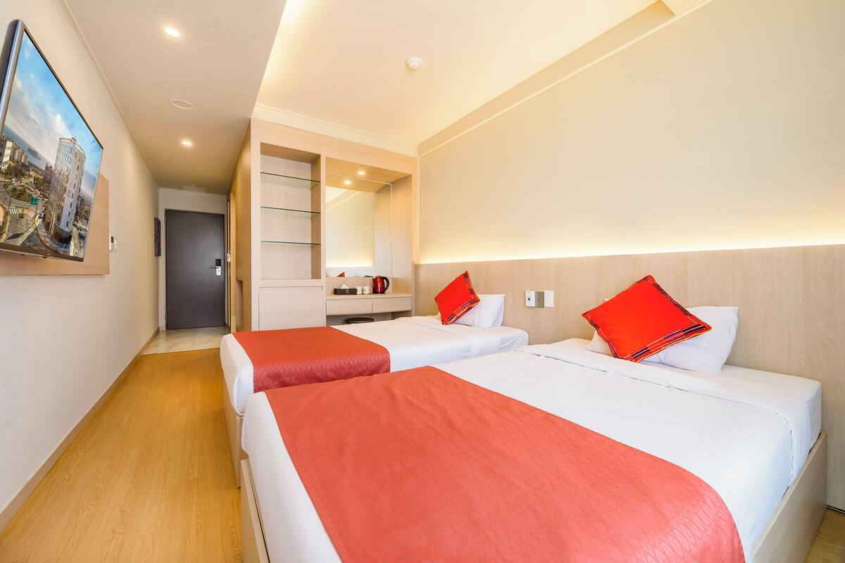 Hypo-allergenic bedding, down duvets, desk, laptop workspace