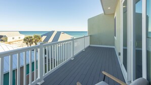 A balcony with a view of the beach and ocean. - Pet Friendly Gulf View Townhome | Sleeps 10 | Game Room (Pensacola Beach)