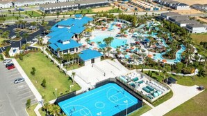 An aerial view of a resort with a swimming pool, tennis courts, and a parking lot. - Upgraded! Stunning Pool, Stylish Decor! Kona Cove Retreat, Prime Disney! (Davenport)