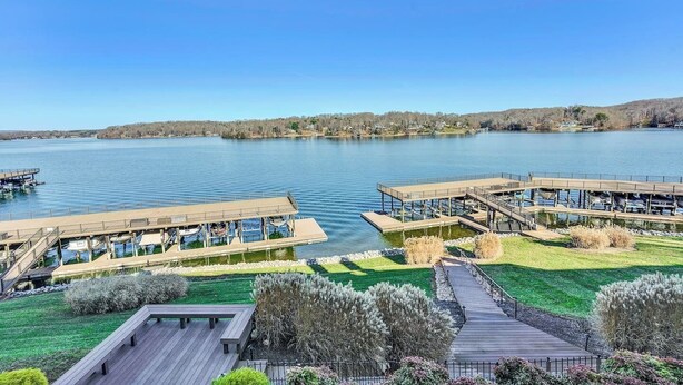 A lakeside hotel with outdoor decks and boat docks.