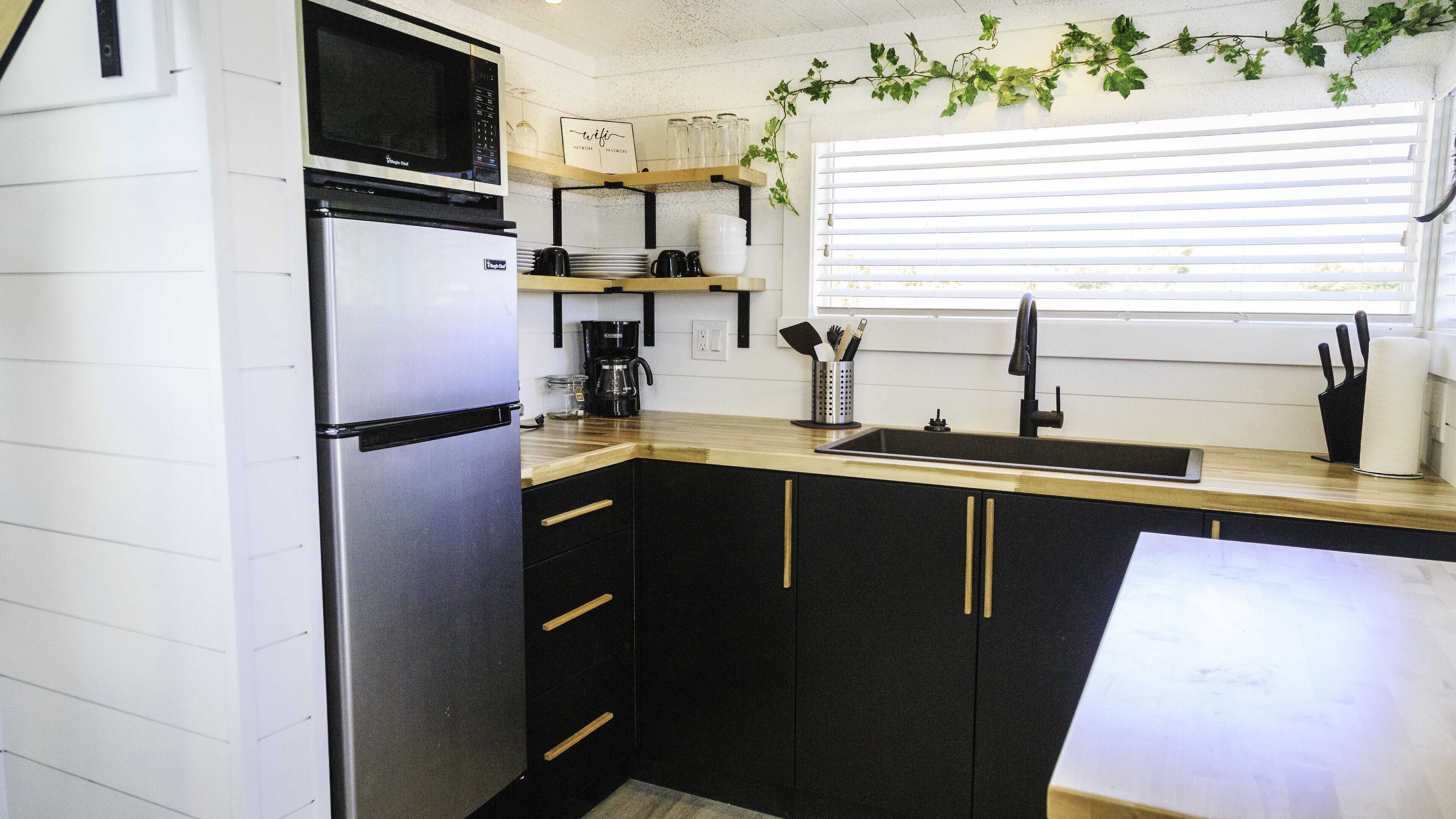 Fridge, microwave, cookware/dishes/utensils, spices