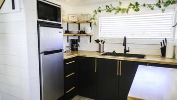 Fridge, microwave, cookware/dishes/utensils, spices