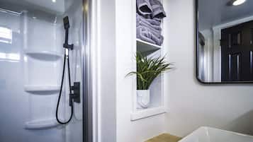 Shower, hair dryer, towels, soap