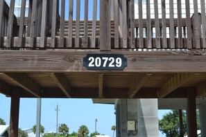 A wooden deck with a sign displaying the number 20729.