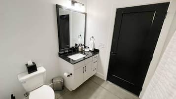 Combined shower/tub, hair dryer, towels, soap