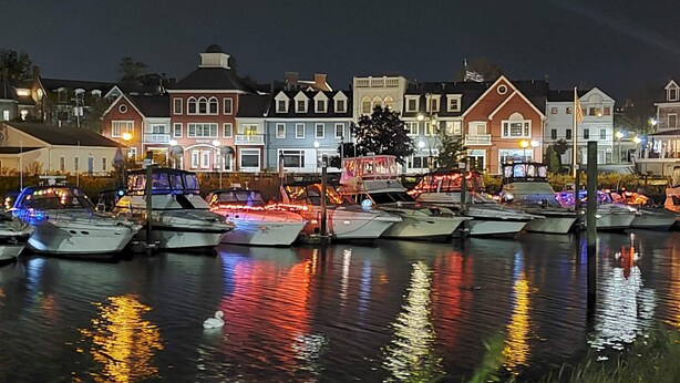 A marina with boats docked in front of a row of houses at night. - The Daydreamer - Walk To Walnut Beach, Restaurant + Shops (Milford)