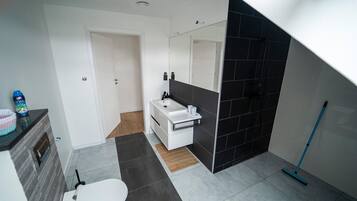 Bathtub, hair dryer, towels, soap