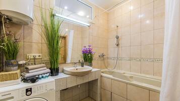Combined shower/tub, hair dryer, towels, soap