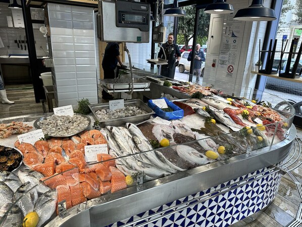 A seafood display with various types of fish and seafood, including salmon and shrimp, in a market setting. - Trullo, Villa with Private Pool- WiFi, Air Con., near Ostuni & Ceglie Messapica (Ceglie Messapica)
