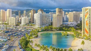 A coastal cityscape with high-rise buildings, a marina, and a beach. - Ocean-Marina Views PH at Ilikai Hotel by the Beach w/Full Kitchen & Free WiFi (Honolulu)