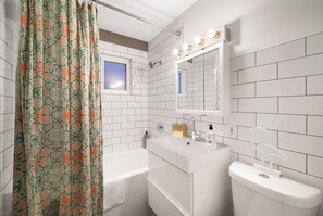 Combined shower/tub, hair dryer, towels, soap