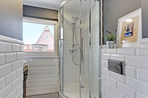 Shower, hair dryer, towels, soap